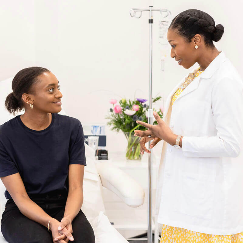 Dr Ifeoma Ejikeme discus with female patient about Silhouette Soft Treatment
