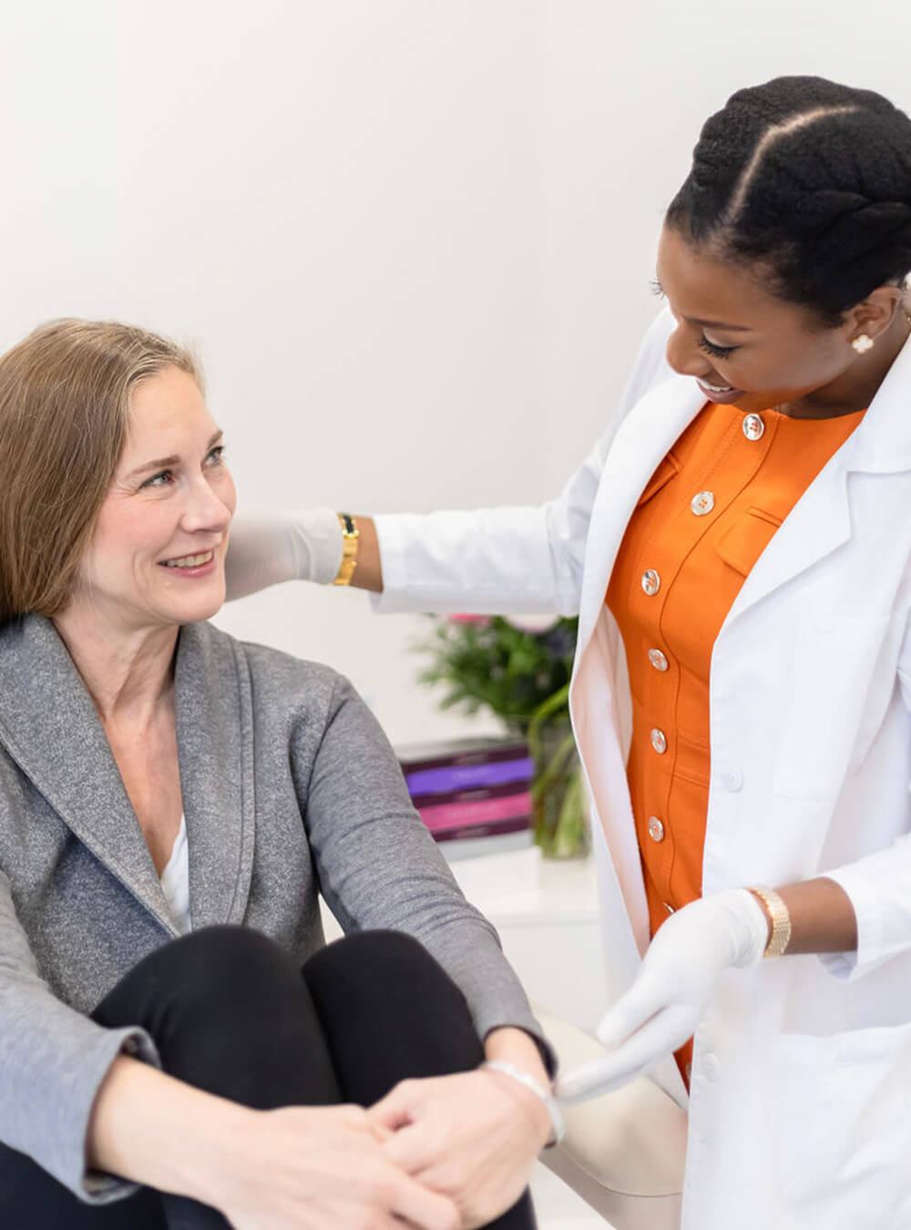 Dr Ifeoma Ejikeme discus with female patient about Hyperhidrosis Treatment